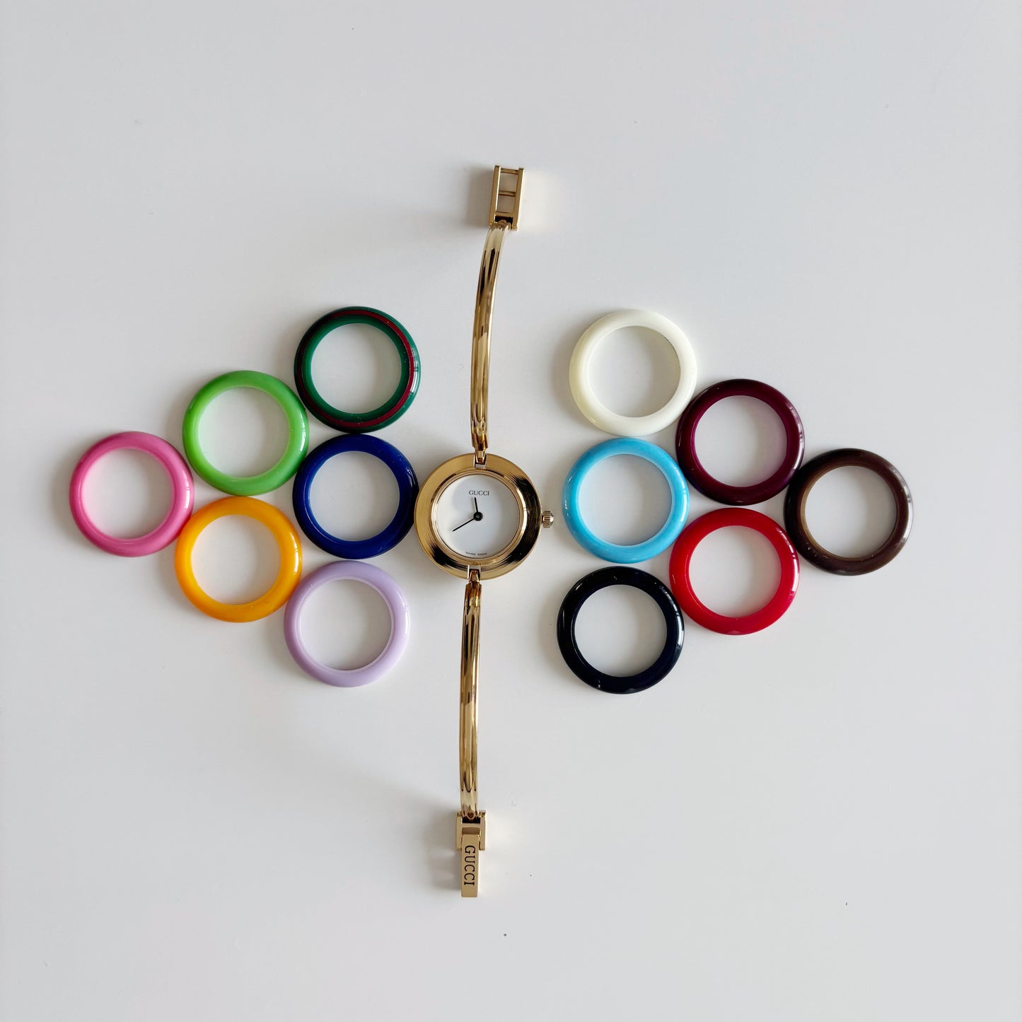 Gucci 1990s Interchangeable Bezel Gold Plated Bangle Watch with 12 bezels, case