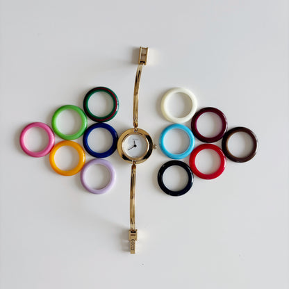 Gucci 1990s Interchangeable Bezel Gold Plated Bangle Watch with 12 bezels, case