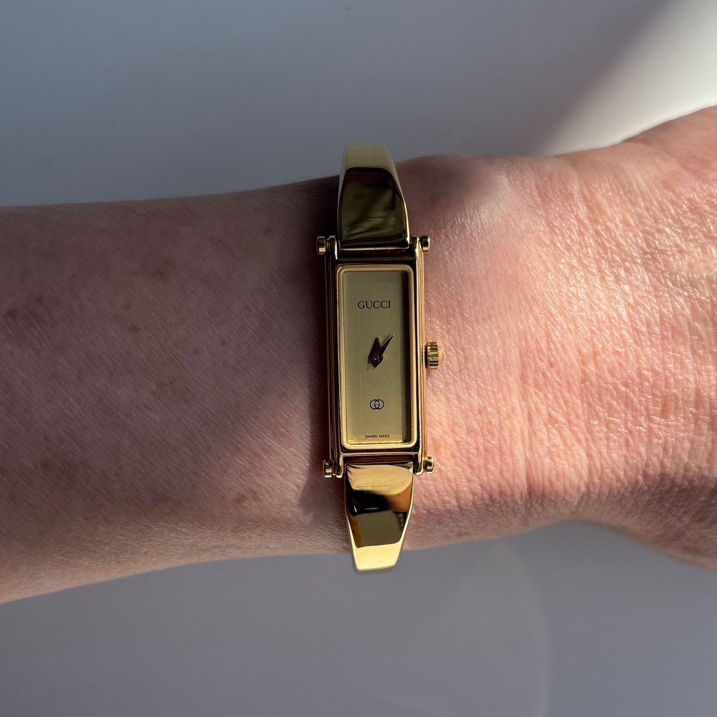 Gucci 1980s Rectangular Gold Dial Gold Plated Bangle Watch