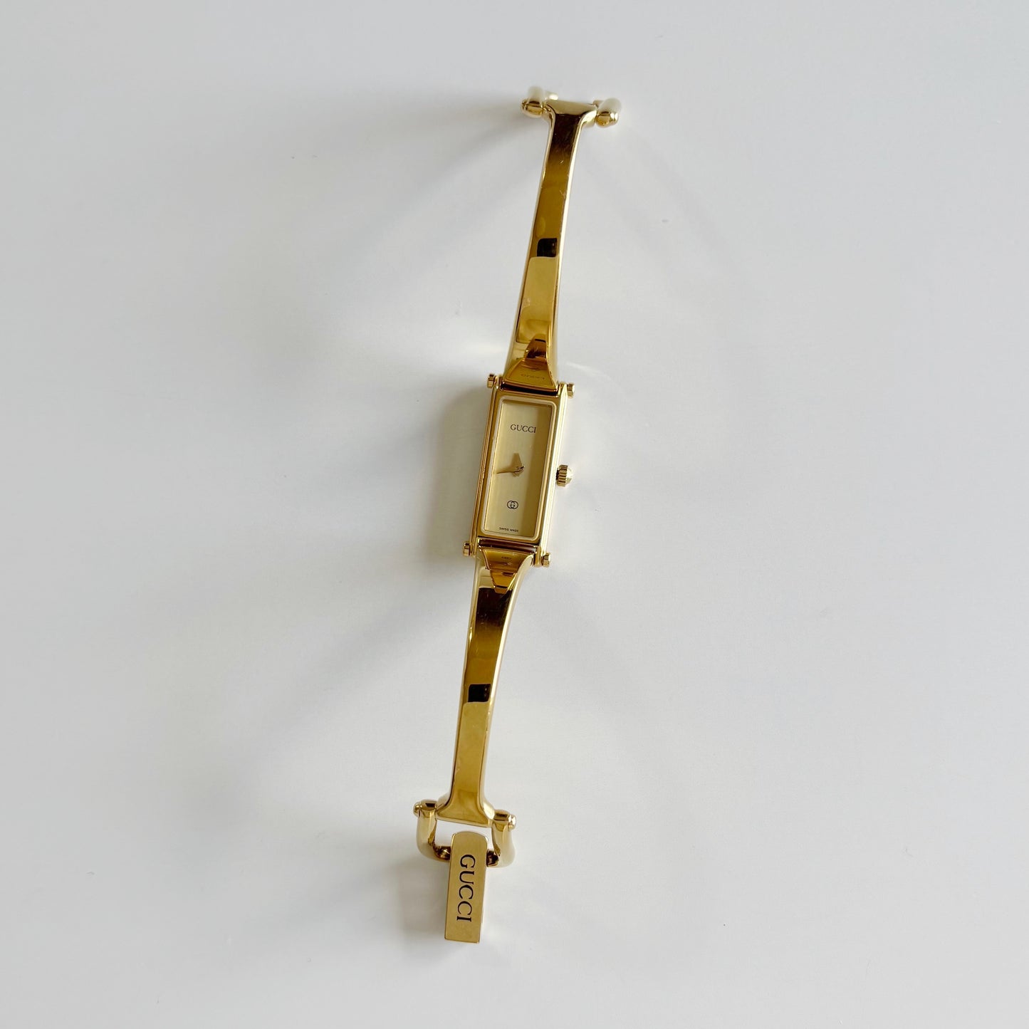 Gucci 1980s Rectangular Gold Dial Gold Plated Bangle Watch