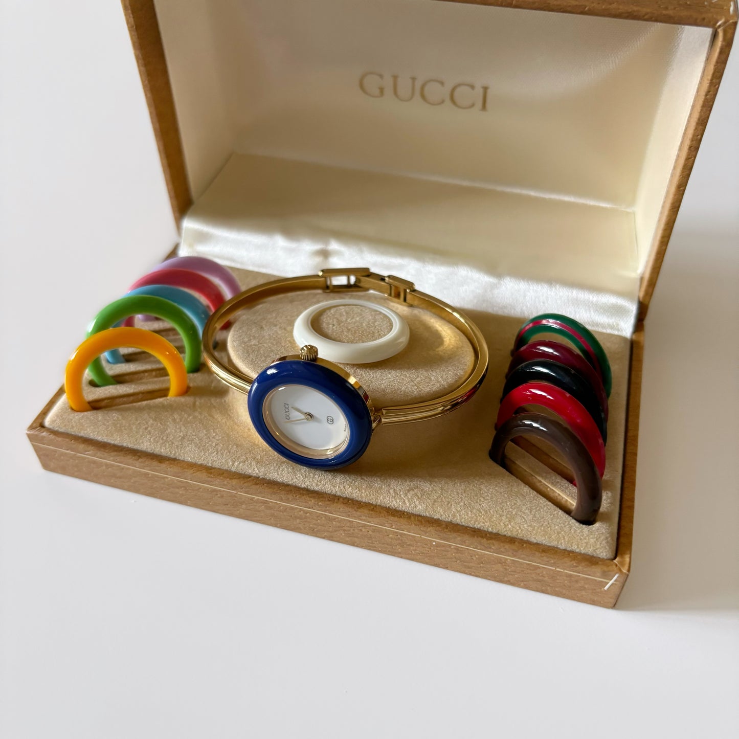 Gucci 1990s Interchangeable Bezel Gold Plated Bangle Watch with case, 12 bezels