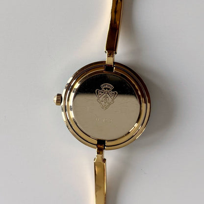 Gucci 1990s Interchangeable Bezel Gold Plated Bangle Watch with 12 bezels, case