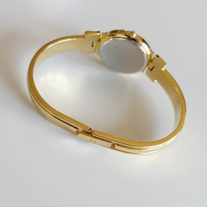 Givenchy 1990s Navy Round Dial Gold Plated Bangle Watch