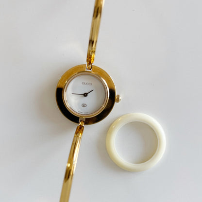 Gucci 1990s Interchangeable Bezel Gold Plated Bangle Watch with 12 bezels, case