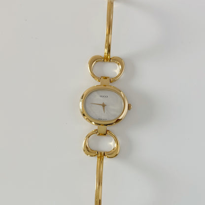 Gucci 1990s Seashell Oval Dial Gold Plated Bangle Watch (Small)