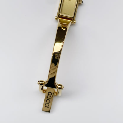 Gucci 1990s Gold Dial Gold Plated Rectangular Bangle Watch