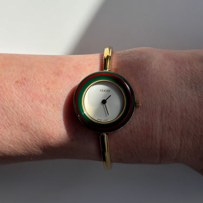 Gucci 1990s Interchangeable Bezel Gold Plated Bangle Watch with 12 bezels, case