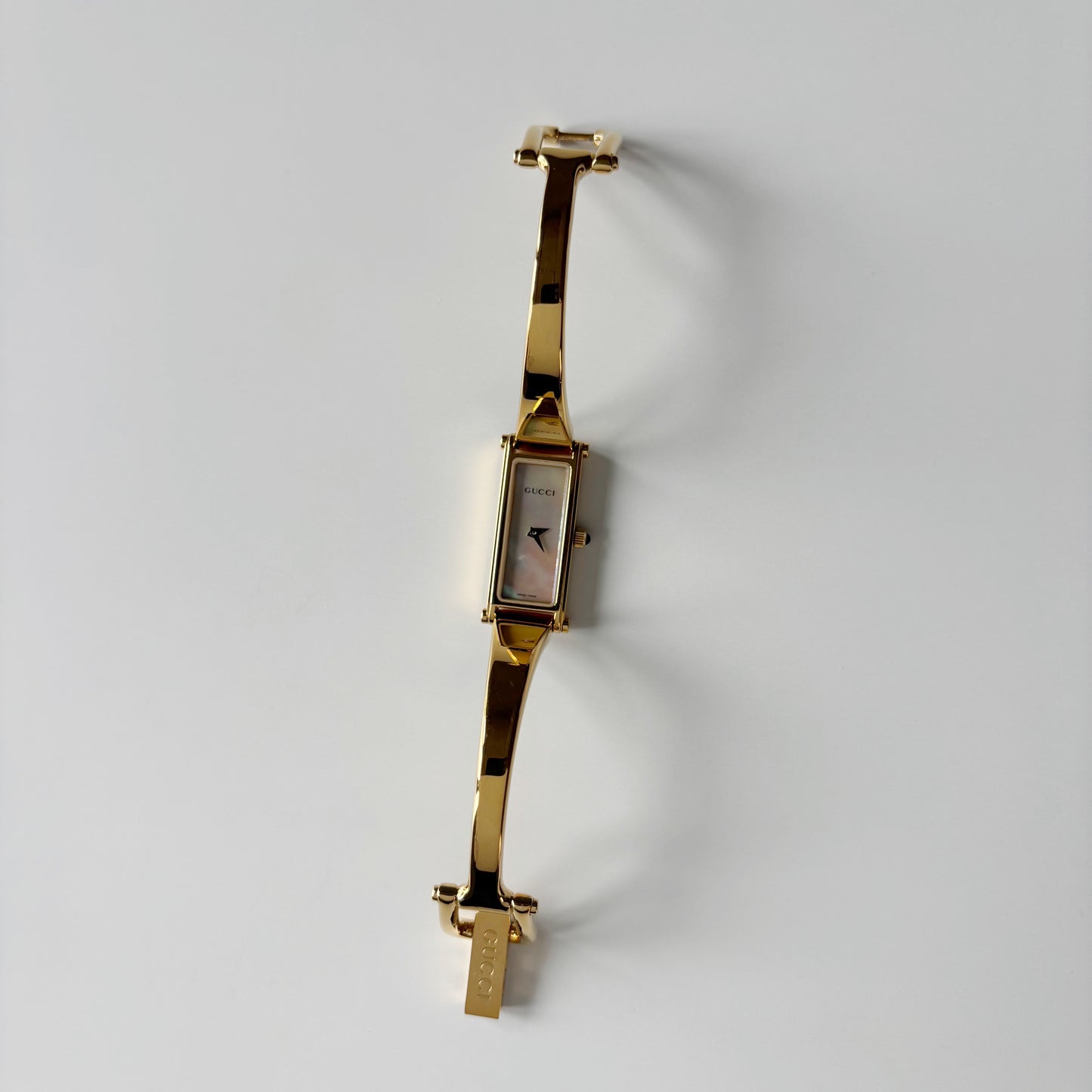 Gucci 1990s Seashell Rectangular Dial Gold Plated Bangle Watch