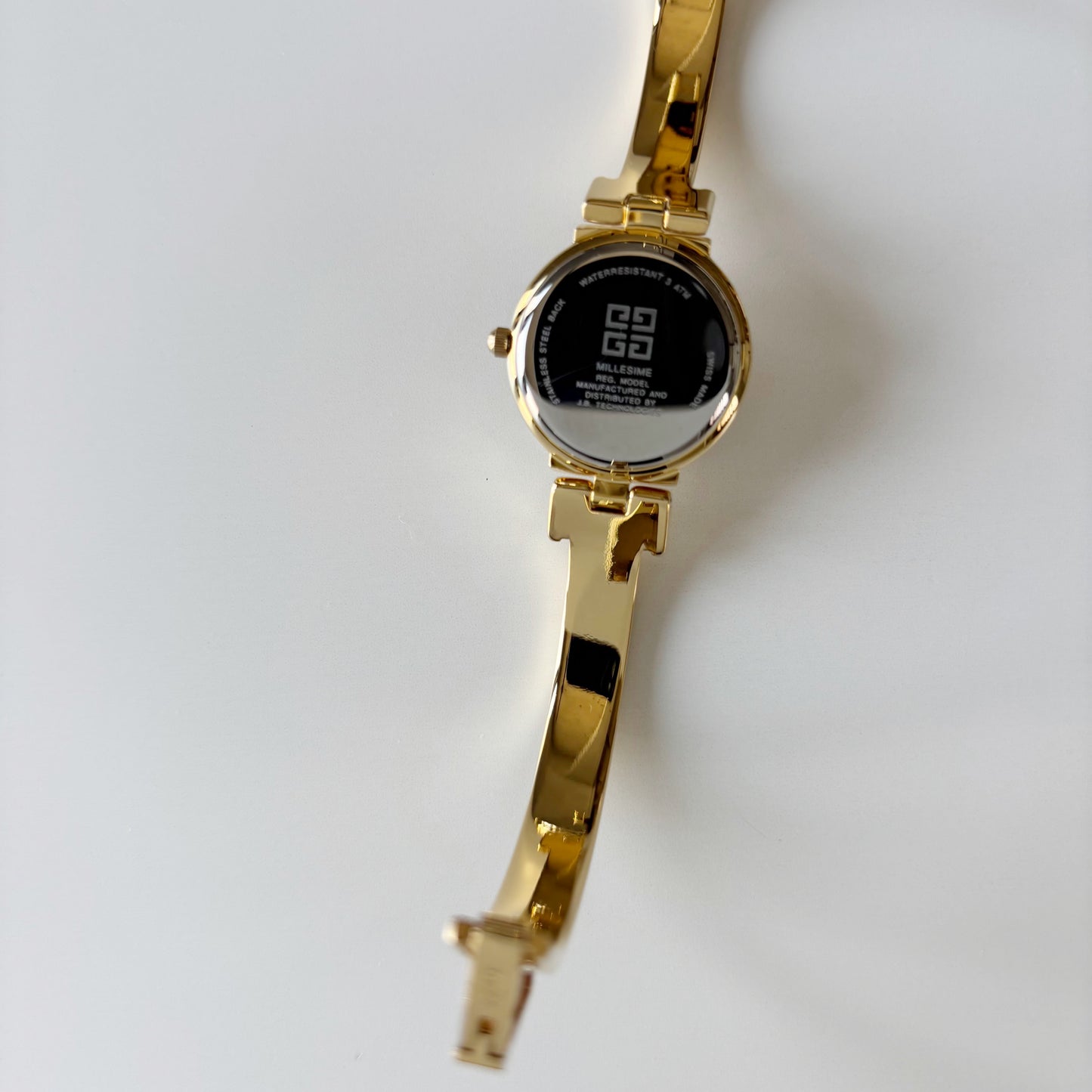 Givenchy 1990s Black Round Dial Gold Plated Bangle Watch