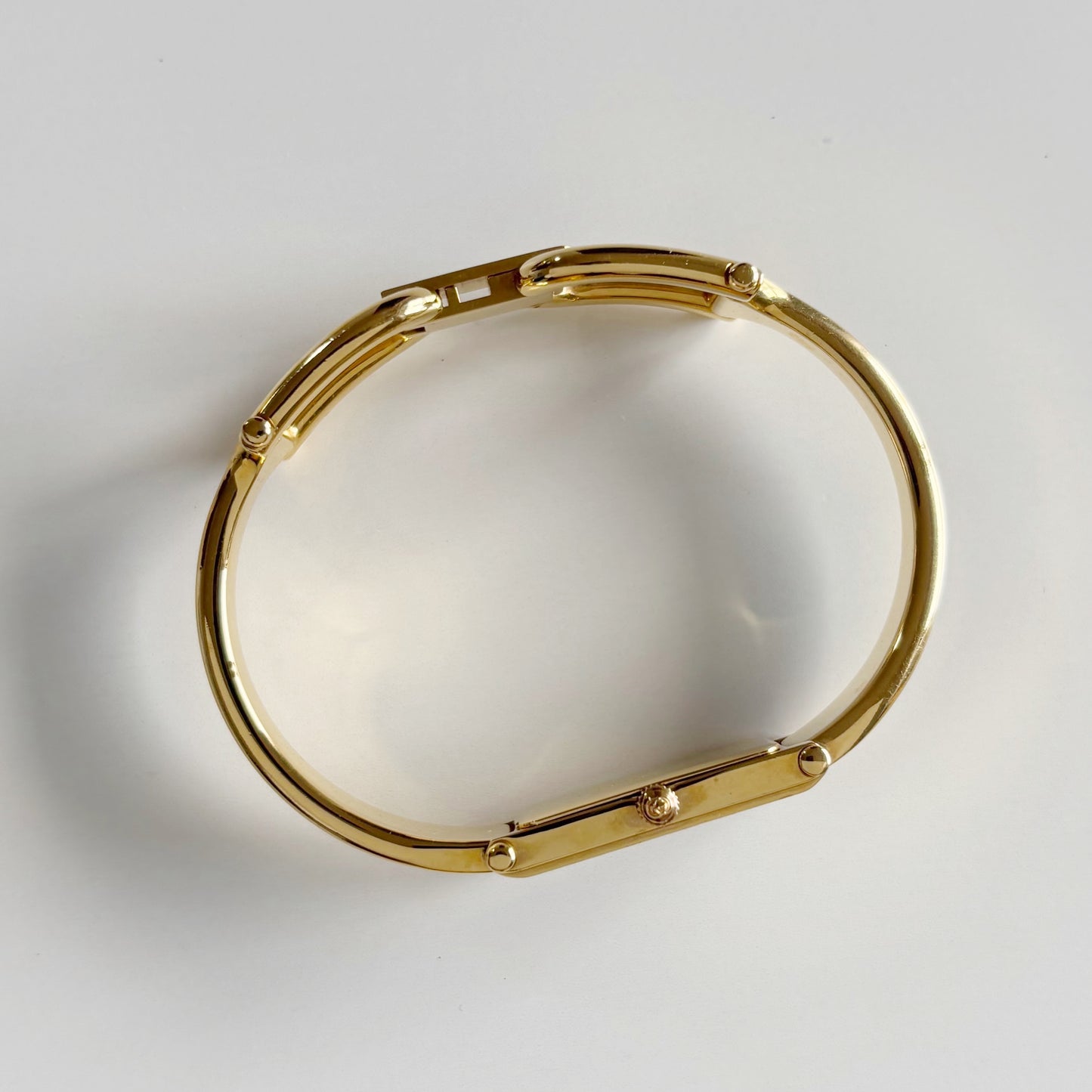 Gucci 1990s Gold Rectangular Dial Gold Plated Bangle Watch