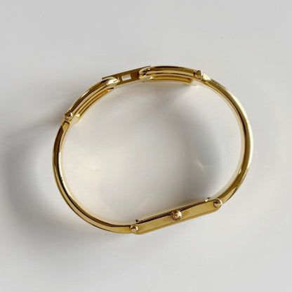 Gucci 1990s Gold Rectangular Dial Gold Plated Bangle Watch