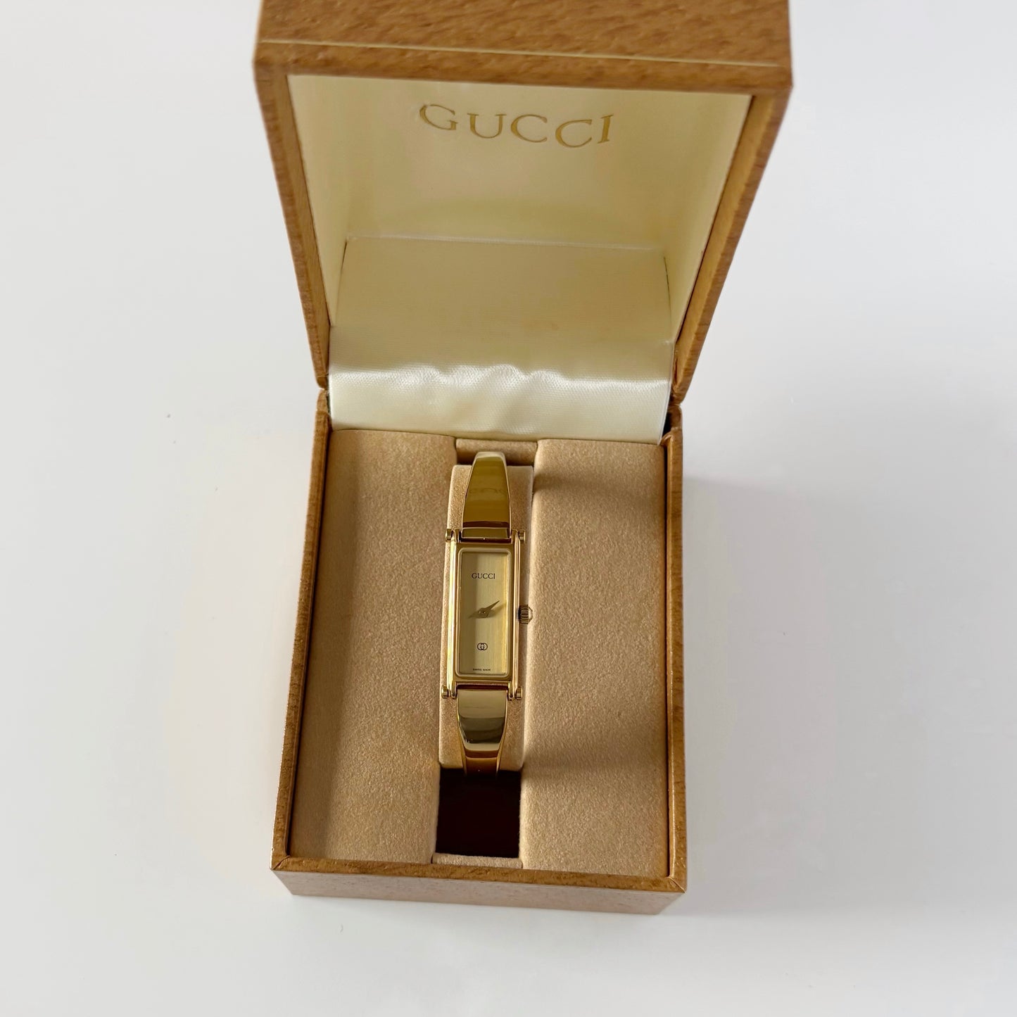 Gucci 1980s Rectangular Gold Dial Gold Plated Bangle Watch