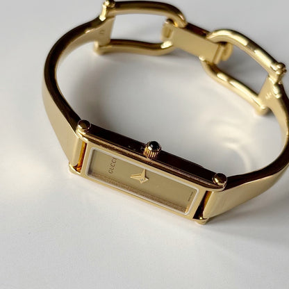 Gucci 1990s Gold Rectangular Dial Gold Plated Bangle Watch (Small)