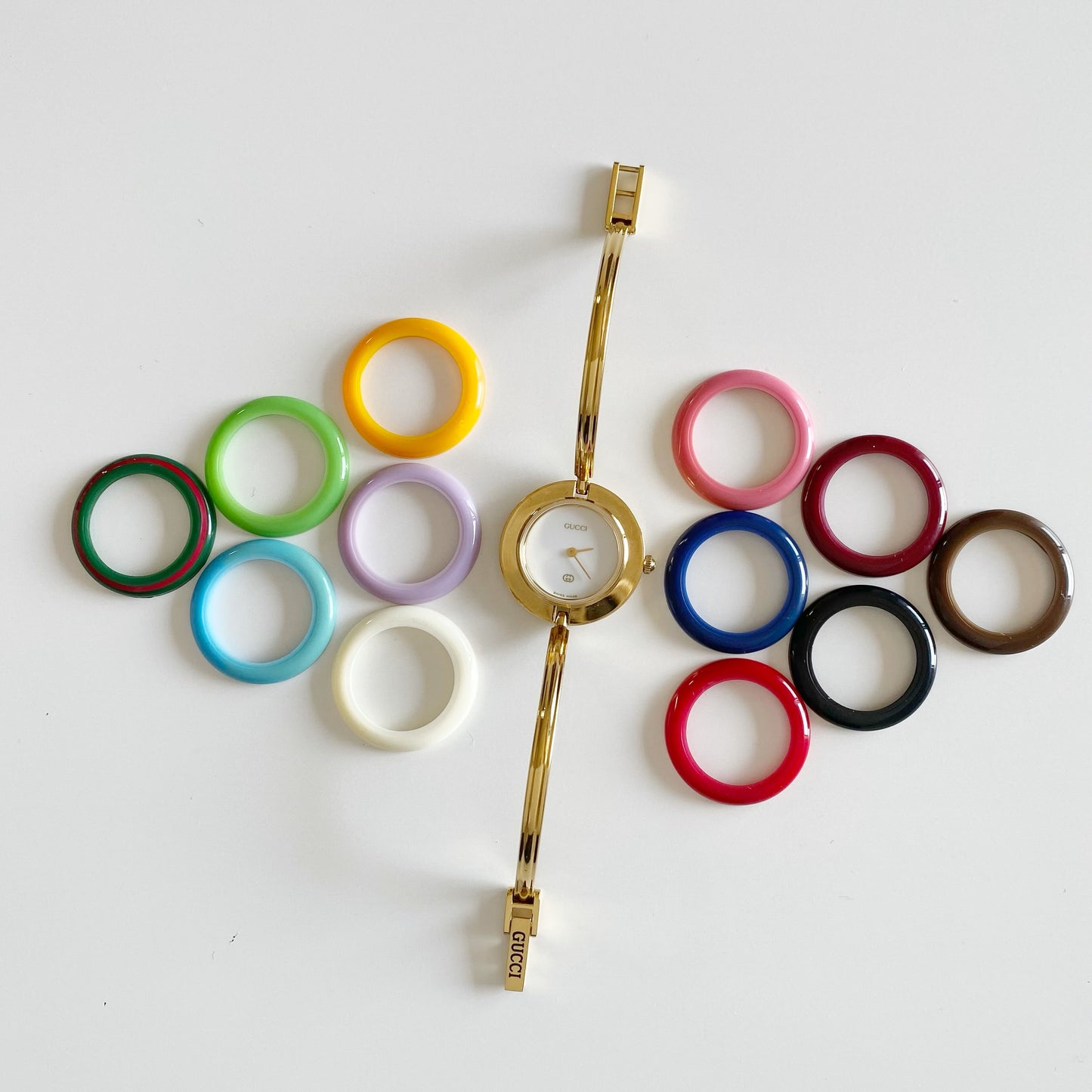 Gucci 1990s Interchangeable Bezel Gold Plated Bangle Watch with 12 bezels, case