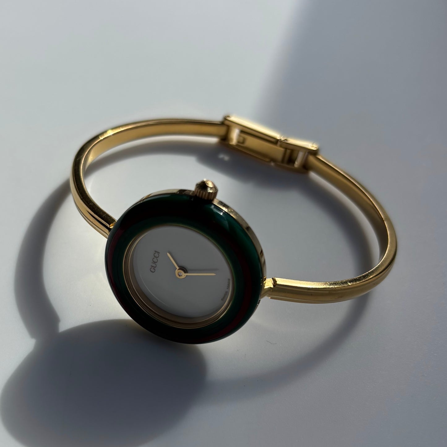 Gucci 1990s Interchangeable Bezel Gold Plated Bangle Watch with 12 bezels, case