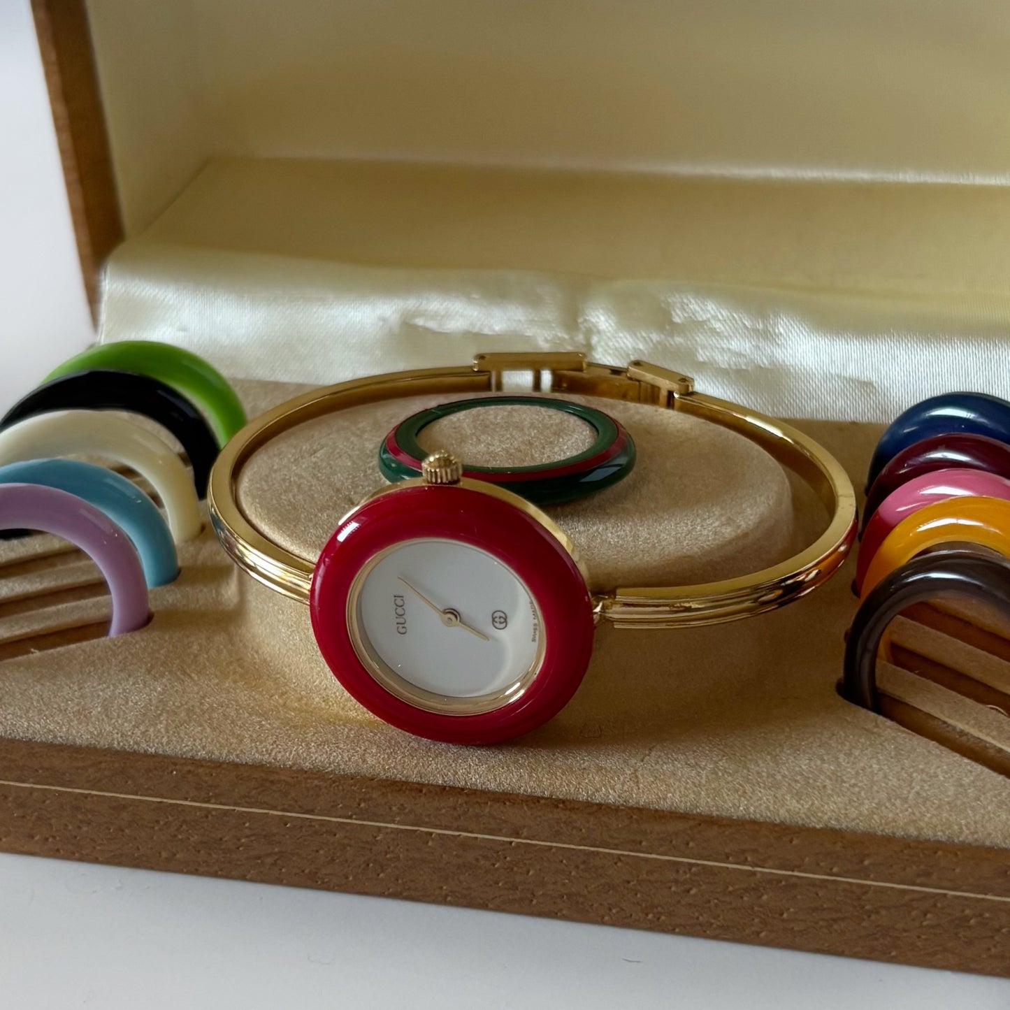 Gucci 1990s Interchangeable Bezel Gold Plated Bangle Watch with 12 bezels, case