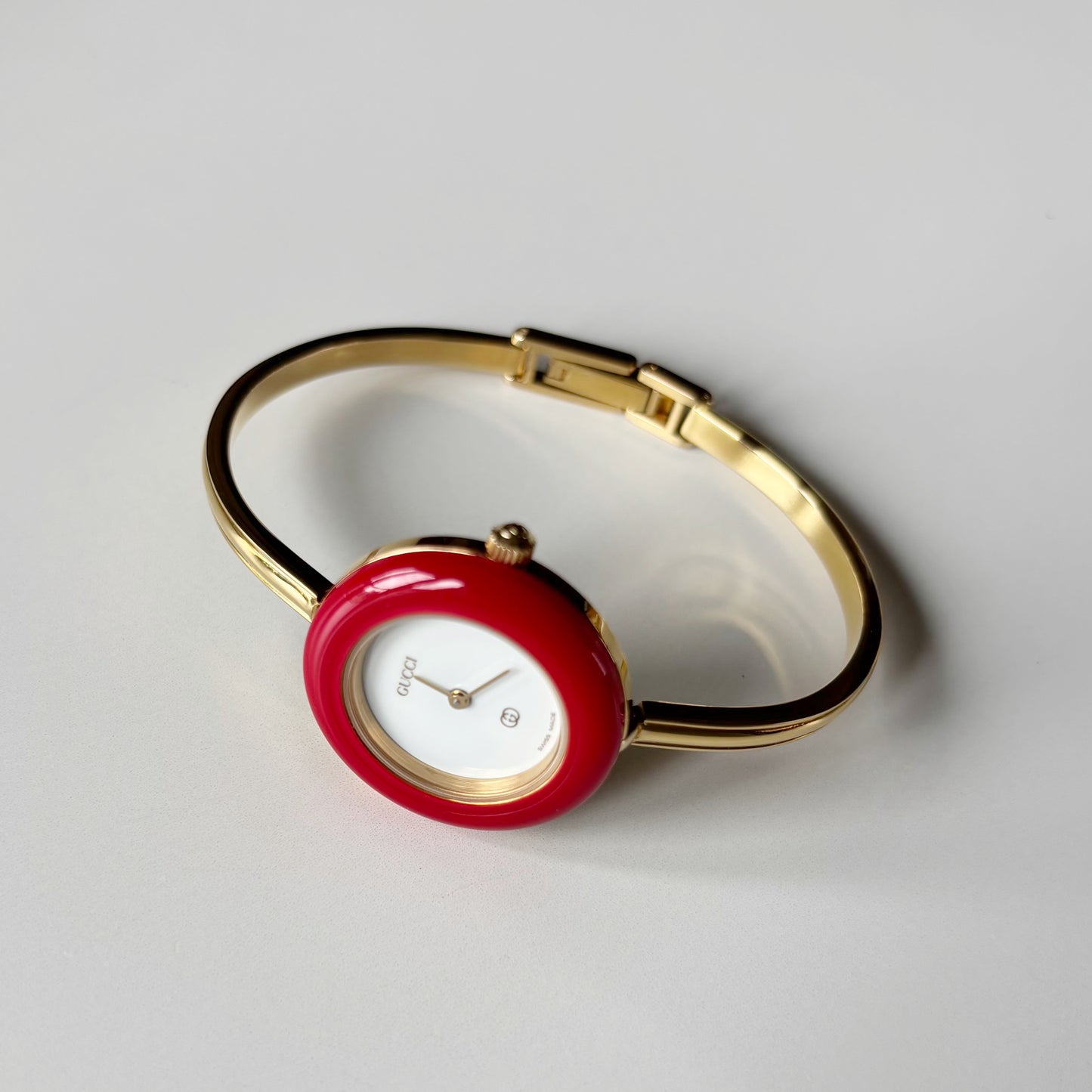 Gucci 1990s Interchangeable Bezel Gold Plated Bangle Watch with 12 bezels, case