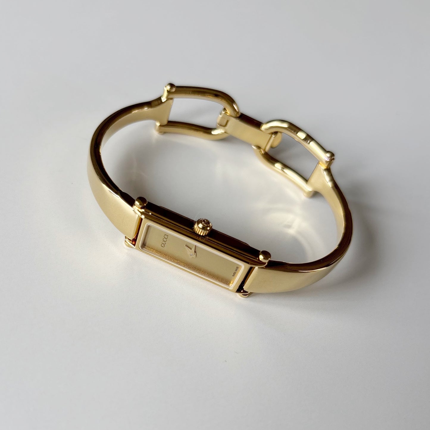 Gucci 1990s Gold Rectangular Dial Gold Plated Bangle Watch