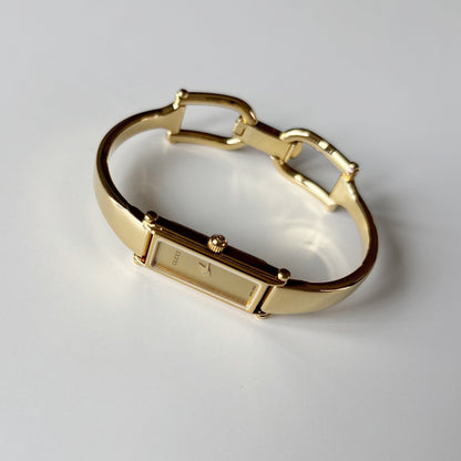 Gucci 1990s Gold Rectangular Dial Gold Plated Bangle Watch