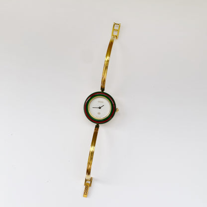 Gucci 1990s Interchangeable Bezel Gold Plated Bangle Watch with 12 bezels, case