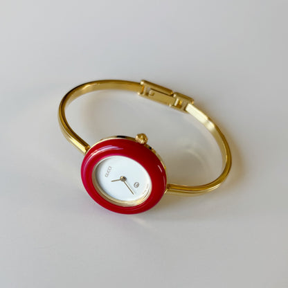 Gucci 1990s Interchangeable Bezel Gold Plated Bangle Watch with 12 bezels, case