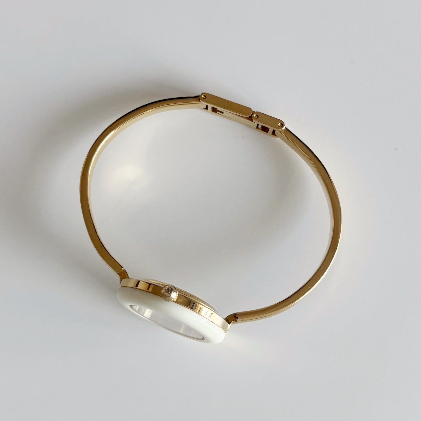 Gucci 1990s Interchangeable Bezel Gold Plated Bangle Watch with 12 bezels, case