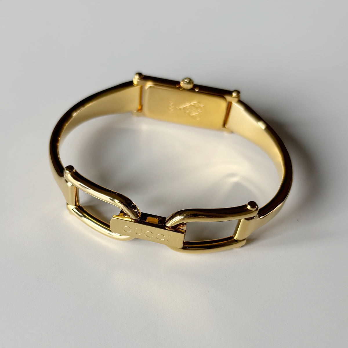Gucci 1990s Gold Rectangular Dial Gold Plated Bangle Watch