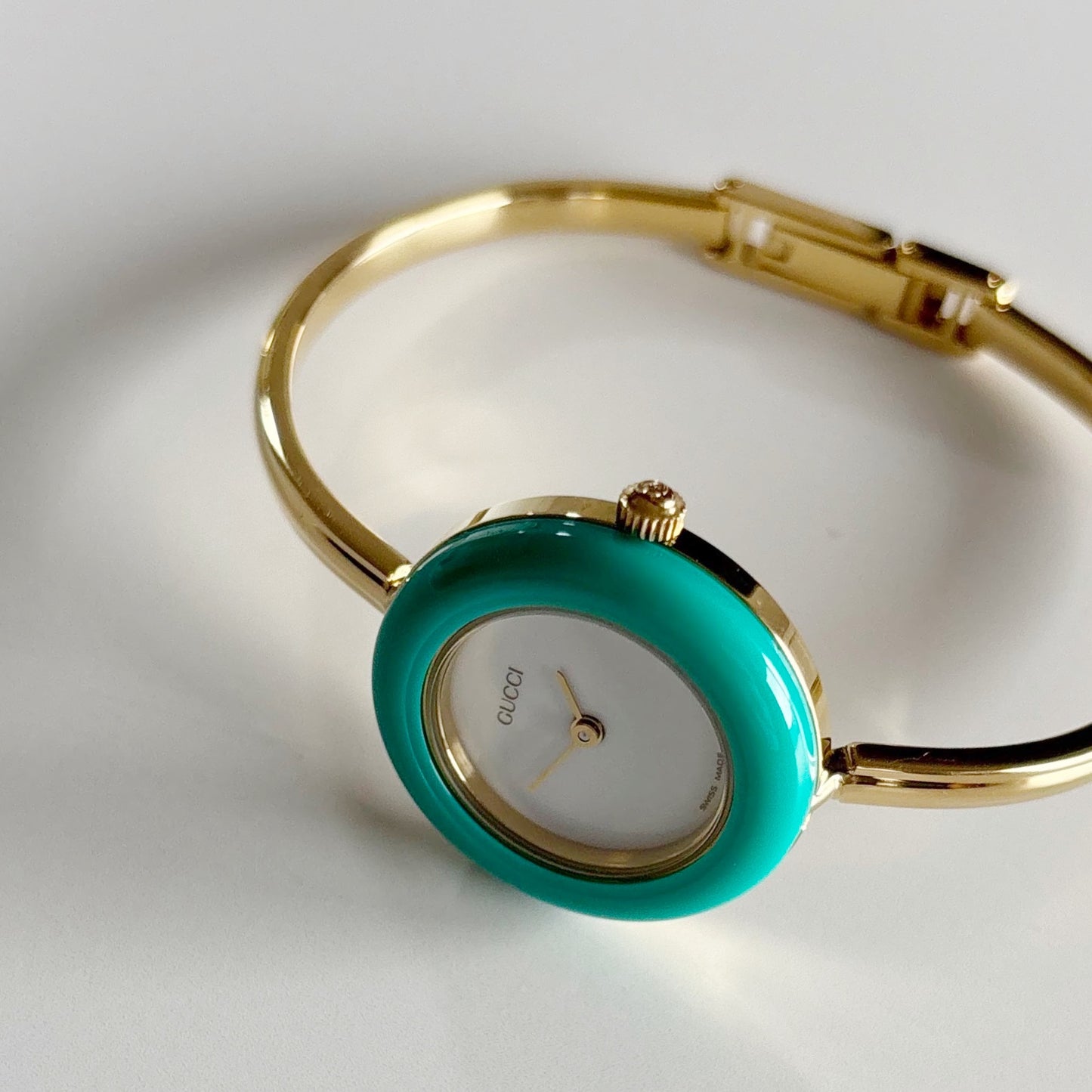 Gucci 1990s Interchangeable Bezel Gold Plated Bangle Watch with 12 bezels, case