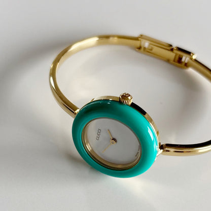Gucci 1990s Interchangeable Bezel Gold Plated Bangle Watch with 12 bezels, case