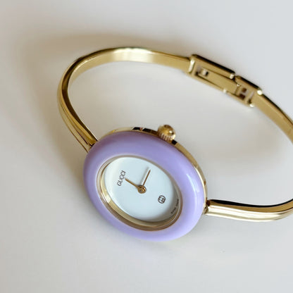 Gucci 1990s Interchangeable Bezel Gold Plated Bangle Watch with 12 bezels, case