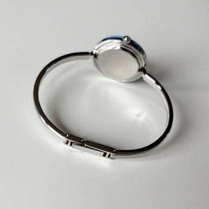 Gucci 1990s Interchangeable Bezel Silver Stainless steel Bangle Watch with 12 bezels, case