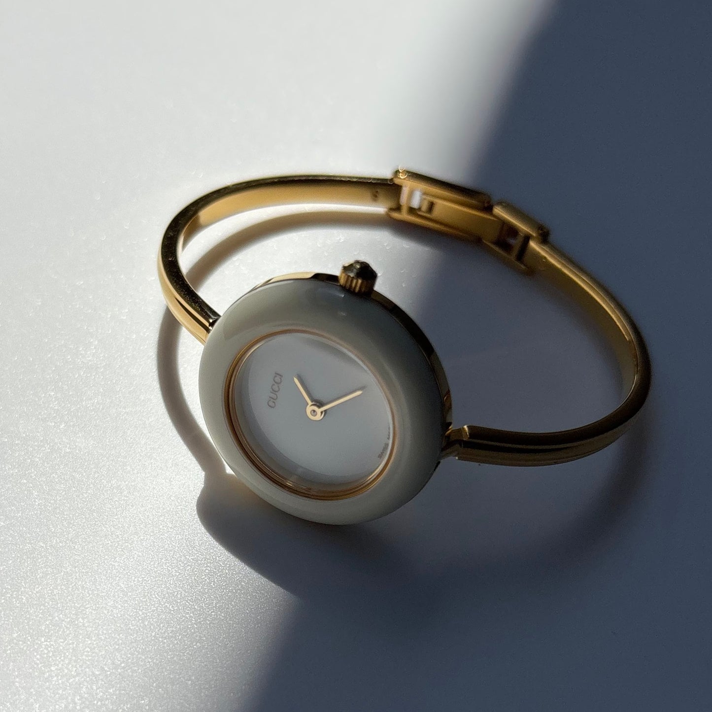 Gucci 1990s Interchangeable Bezel Gold Plated Bangle Watch with case, 12 bezels (Small)