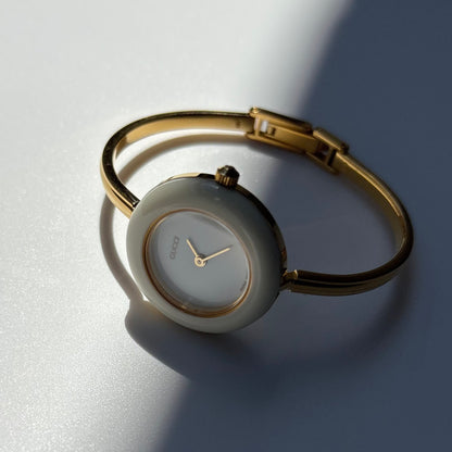 Gucci 1990s Interchangeable Bezel Gold Plated Bangle Watch with case, 12 bezels (Small)