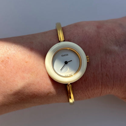 Gucci 1990s Interchangeable Bezel Gold Plated Bangle Watch with 12 bezels, case