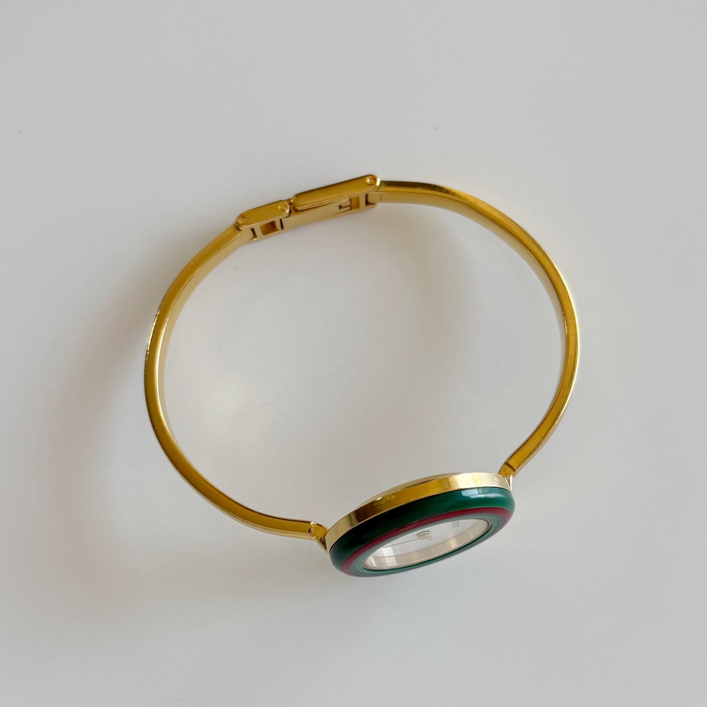 Gucci 1990s Interchangeable Bezel Gold Plated Bangle Watch with 12 bezels, case