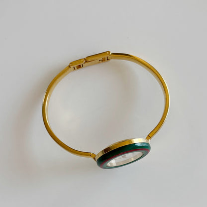 Gucci 1990s Interchangeable Bezel Gold Plated Bangle Watch with 12 bezels, case