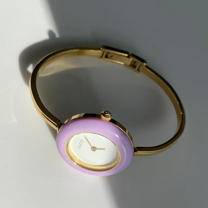 Gucci 1990s Interchangeable Bezel Gold Plated Bangle Watch with 12 bezels, case