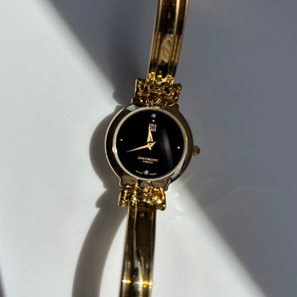 Givenchy 1990s Black Round Dial Gold Plated Bangle Watch