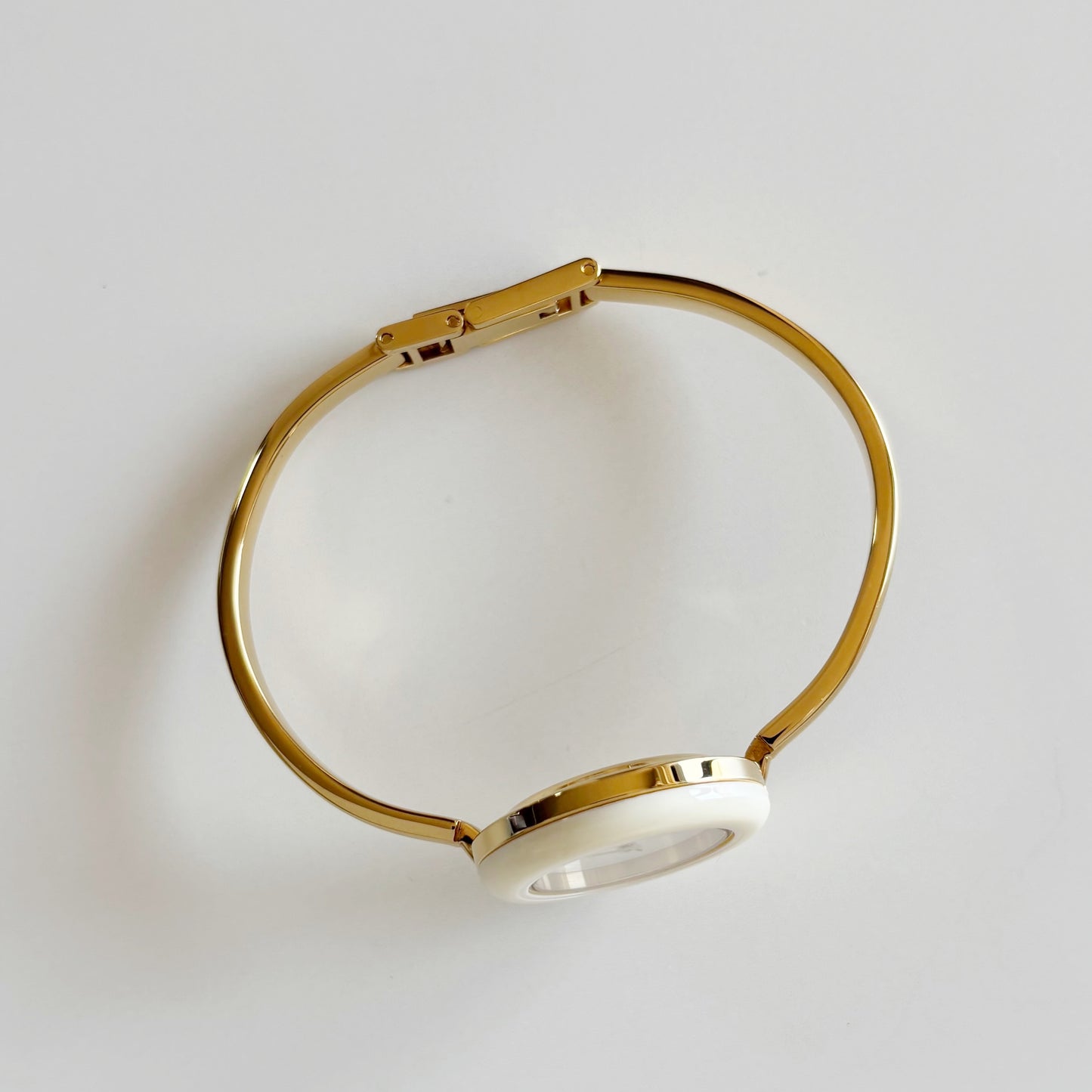 Gucci 1990s Interchangeable Bezel Gold Plated Bangle Watch with 12 bezels, case