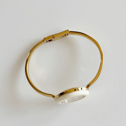 Gucci 1990s Interchangeable Bezel Gold Plated Bangle Watch with 12 bezels, case
