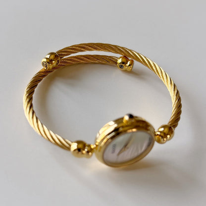 Gucci 1990s Seashell Round Dial Gold-Plated Cable Bangle Watch