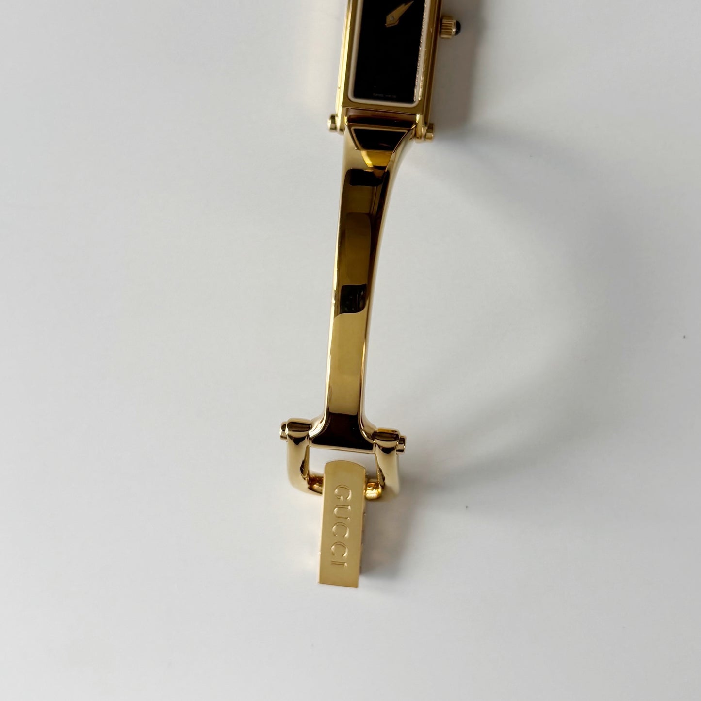 Gucci 1990s Black Rectangular Dial Gold Plated Bangle Watch