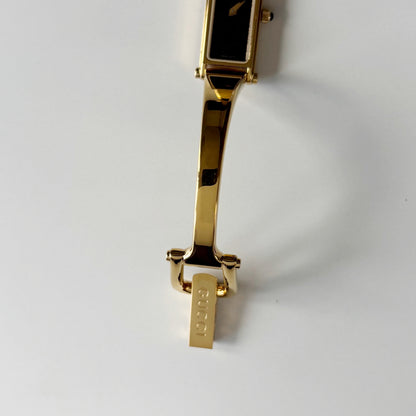 Gucci 1990s Black Rectangular Dial Gold Plated Bangle Watch