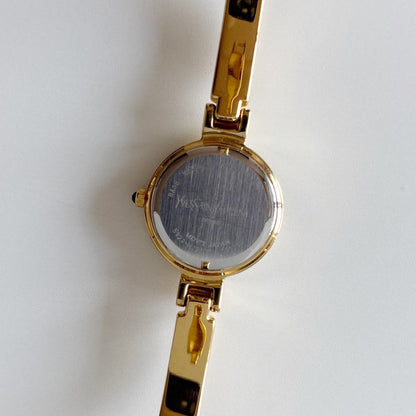Yves Saint Laurent 1990s Black Round Dial Gold Plated Bangle Watch
