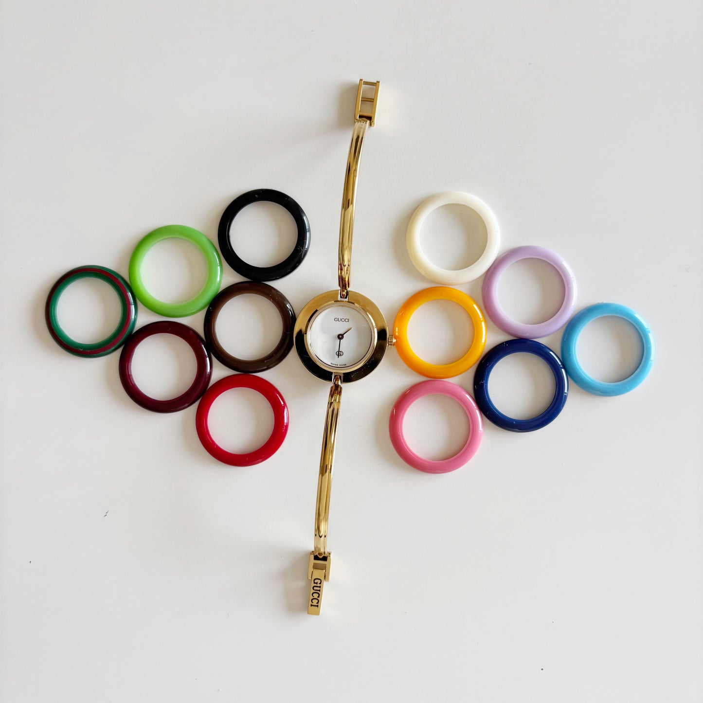 Gucci 1990s Interchangeable Bezel Gold Plated Bangle Watch with 12 bezels, case
