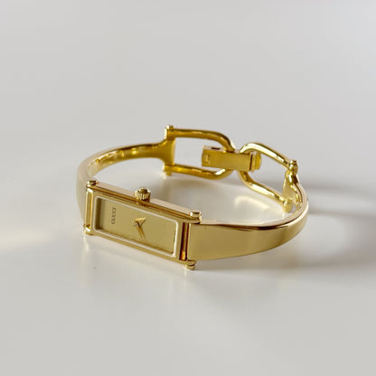 Gucci 1990s Gold Rectangular Dial Gold Plated Bangle Watch