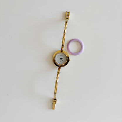 Gucci 1990s Interchangeable Bezel Gold Plated Bangle Watch with 12 bezels, case