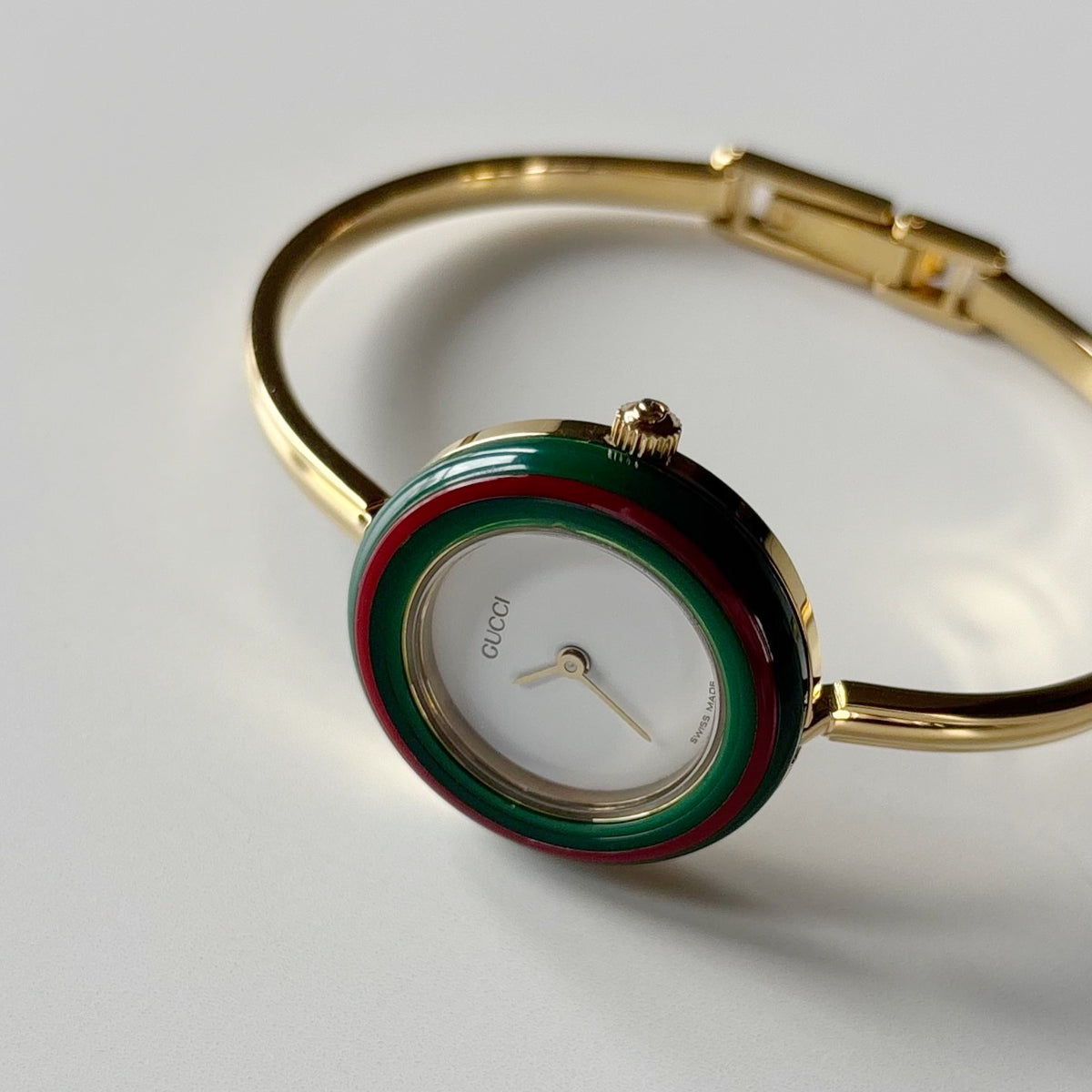 Gucci 1990s Interchangeable Bezel Gold Plated Bangle Watch with 12 bezels, case