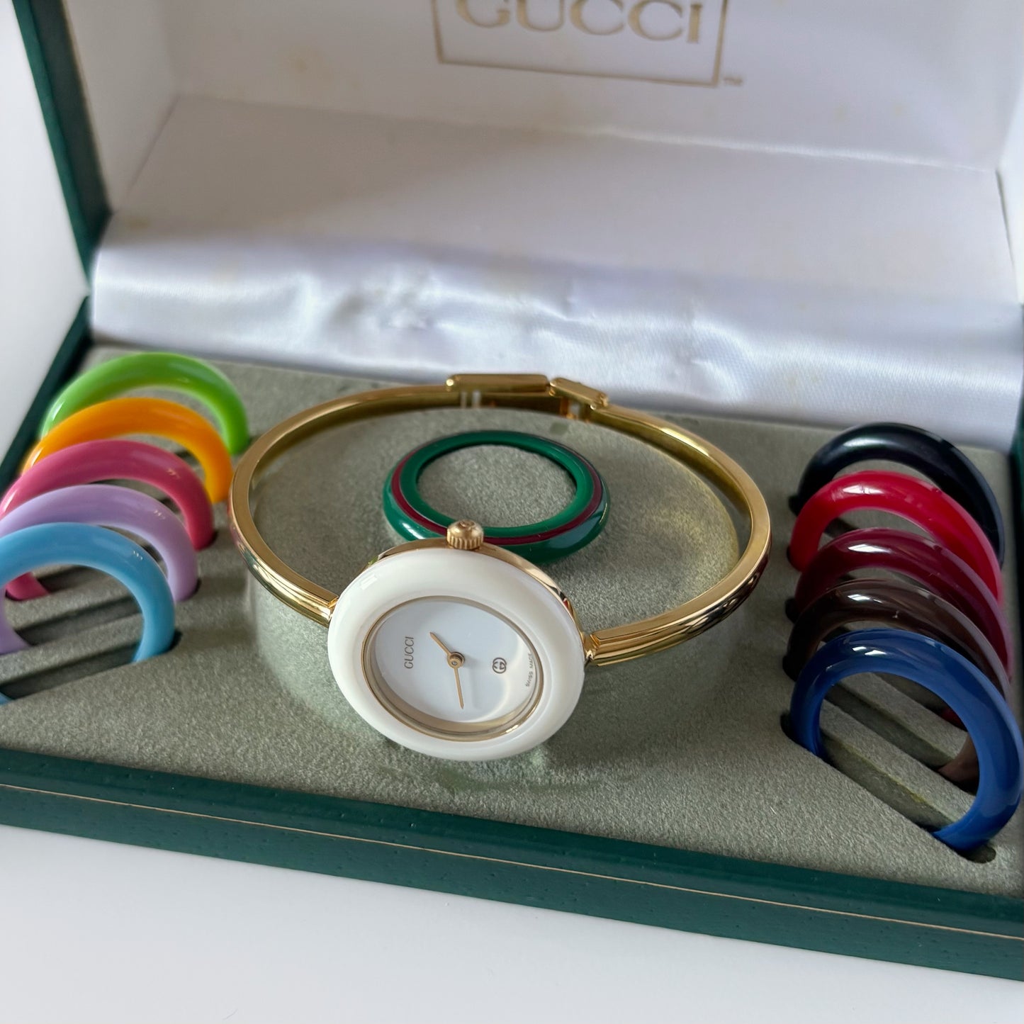 Gucci 1990s Interchangeable Bezel Gold Plated Bangle Watch with 12 bezels, case