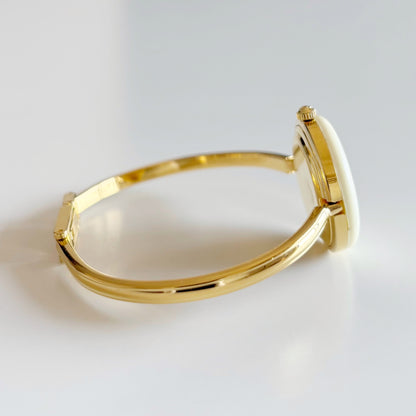 Gucci 1990s Interchangeable Bezel Gold Plated Bangle Watch with 12 bezels, case